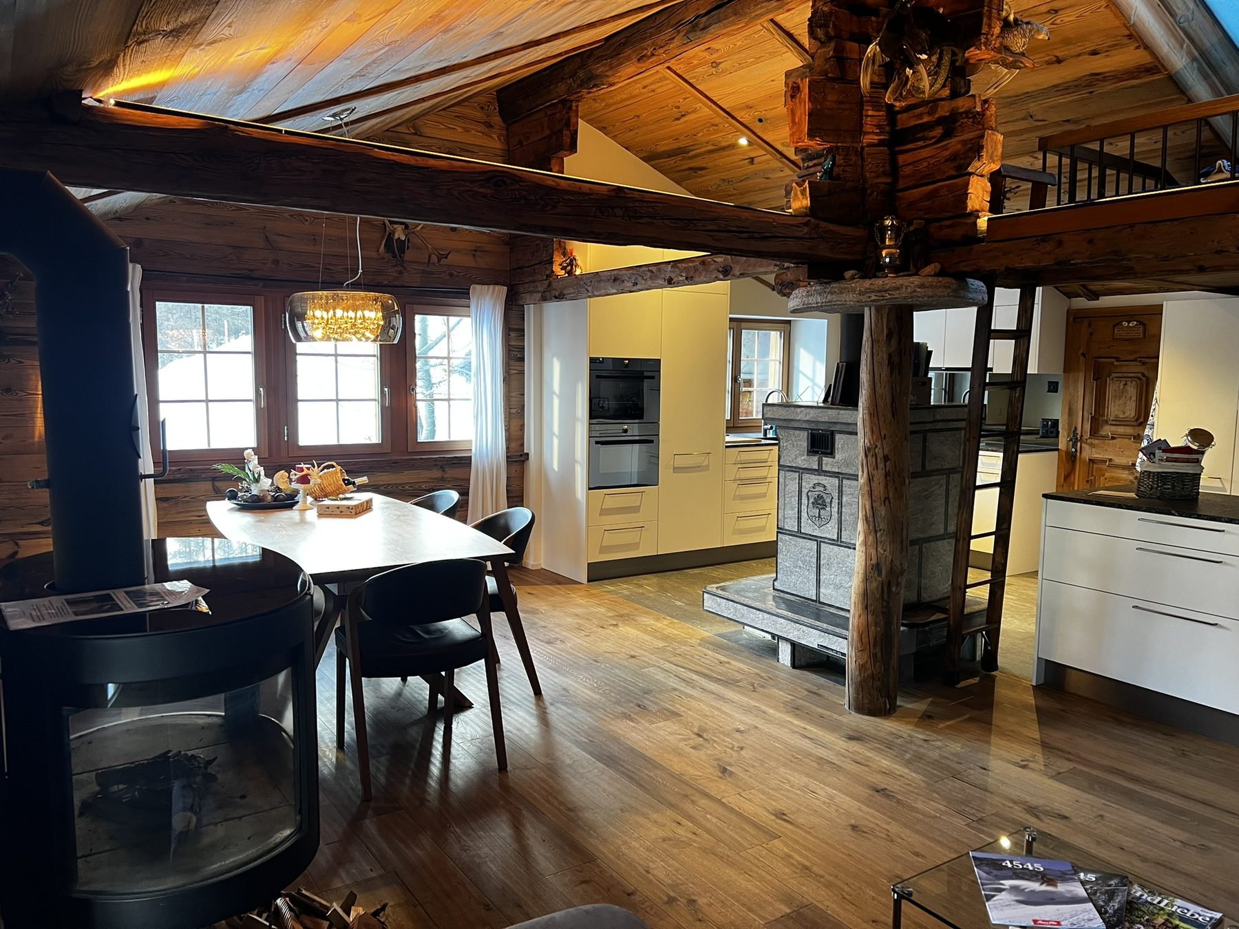 Châlet apartment living room with the soapstone stove